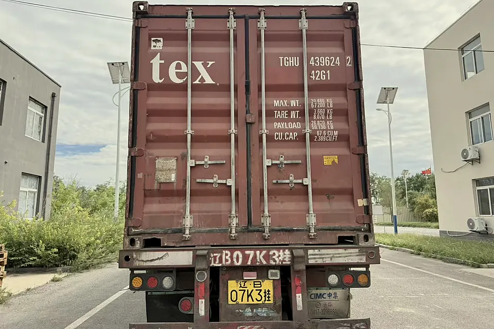 Closed shipping container on a truck at the gate