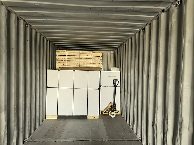 Packed pianos stacked inside a shipping container